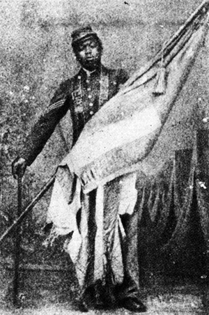 Picture of William Harvey Carney with the battle flag